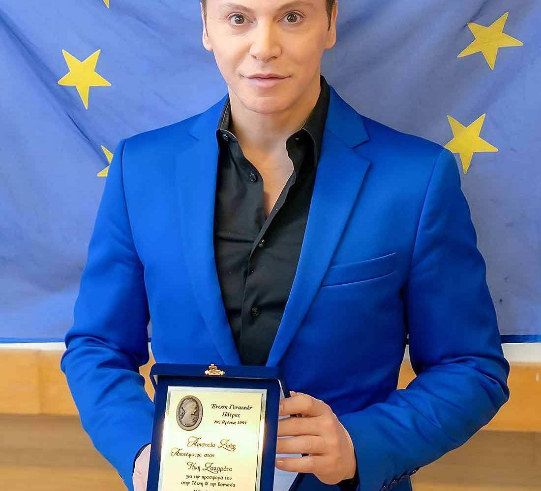 Takis-Zacharatos-a-great-actor-posing-with-his-award-from-women-union-of-patras